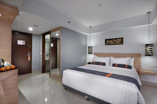 Imagen de la habitación del Hotel Harper Mt Haryono By Aston. Foto 6