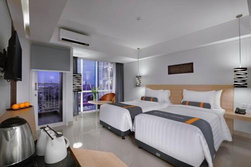 Imagen de la habitación del Hotel Harper Mt Haryono By Aston. Foto 7