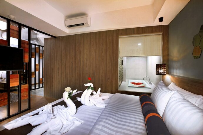 Imagen de la habitación del Hotel Harper Purwakarta. Foto 17