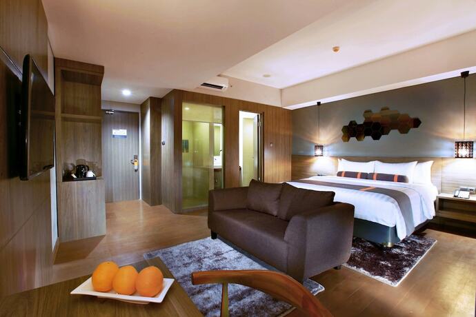 Imagen de la habitación del Hotel Harper Purwakarta. Foto 20