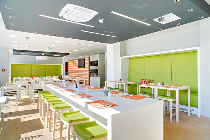 Imagen del bar/restaurante del Hotel Harry’s Home and Apartments. Foto 3