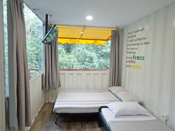 Imagen de la habitación del Hotel Hau Eco Lodges Citumang. Foto 10
