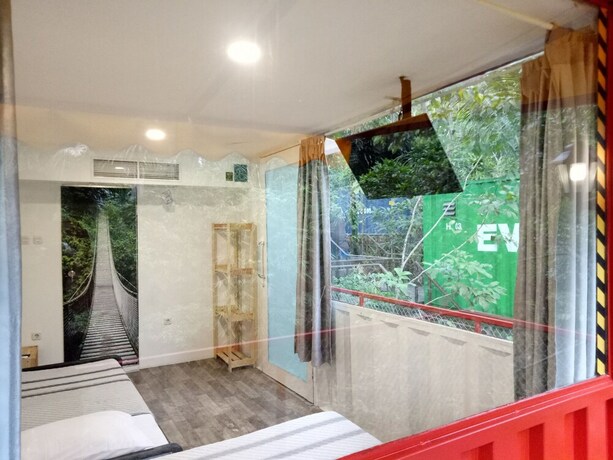 Imagen de la habitación del Hotel Hau Eco Lodges Citumang. Foto 15