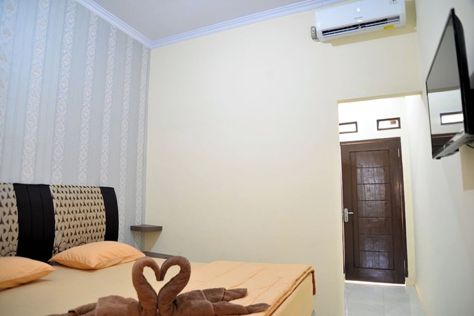 Imagen de la habitación del Hotel Haura syariah. Foto 7