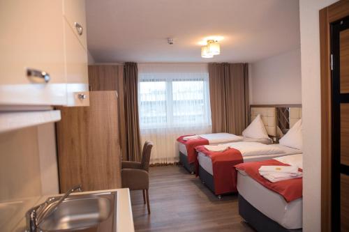 Imagen de la habitación del Hotel Hausen Obertshausen Frankfurt. Foto 7