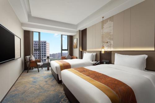 Imagen de la habitación del Hotel Hawthorn by Wyndham Changsha Furong. Foto 11