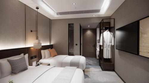 Imagen de la habitación del Hotel Hawthorn by Wyndham Changsha Furong. Foto 12