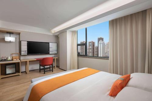 Imagen de la habitación del Hotel Hawthorn by Wyndham Dali Erhai Park. Foto 13