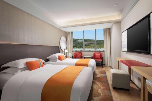 Imagen de la habitación del Hotel Hawthorn by Wyndham Dali Erhai Park. Foto 14