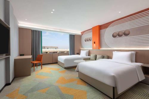 Imagen de la habitación del Hotel Hawthorn by Wyndham Guangzhou Baiyun Airport. Foto 15