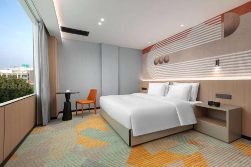 Imagen de la habitación del Hotel Hawthorn by Wyndham Guangzhou Baiyun Airport. Foto 17