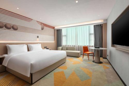 Imagen de la habitación del Hotel Hawthorn by Wyndham Guangzhou Baiyun Airport. Foto 18