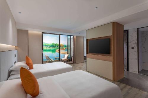 Imagen de la habitación del Hotel Hawthorn by Wyndham Honghe Mile Hot Spring. Foto 9
