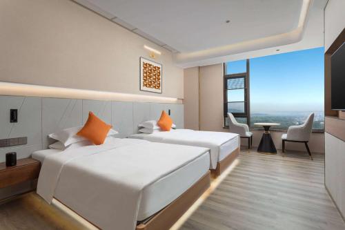 Imagen de la habitación del Hotel Hawthorn by Wyndham Honghe Mile Hot Spring. Foto 10