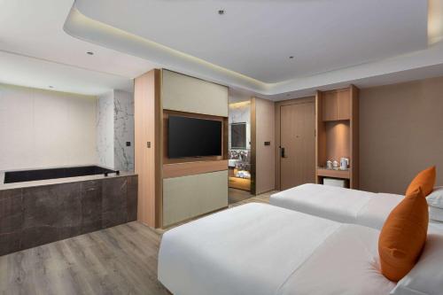 Imagen de la habitación del Hotel Hawthorn by Wyndham Honghe Mile Hot Spring. Foto 11