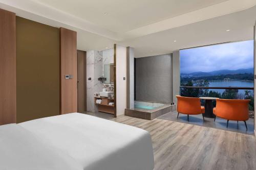 Imagen de la habitación del Hotel Hawthorn by Wyndham Honghe Mile Hot Spring. Foto 12