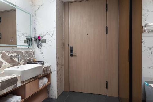 Imagen de la habitación del Hotel Hawthorn by Wyndham Honghe Mile Hot Spring. Foto 13