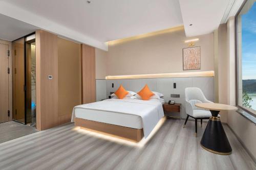 Imagen de la habitación del Hotel Hawthorn by Wyndham Honghe Mile Hot Spring. Foto 15