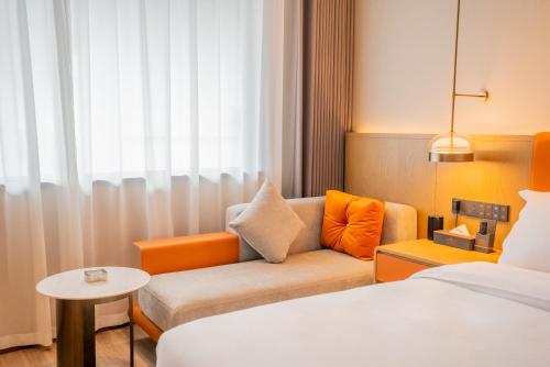 Imagen de la habitación del Hotel Hawthorn by Wyndham Xishuang Banna Jinghong. Foto 3