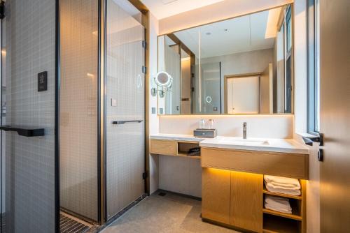 Imagen de la habitación del Hotel Hawthorn by Wyndham Xishuang Banna Jinghong. Foto 4
