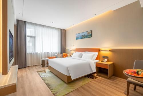 Imagen de la habitación del Hotel Hawthorn by Wyndham Xishuang Banna Jinghong. Foto 5