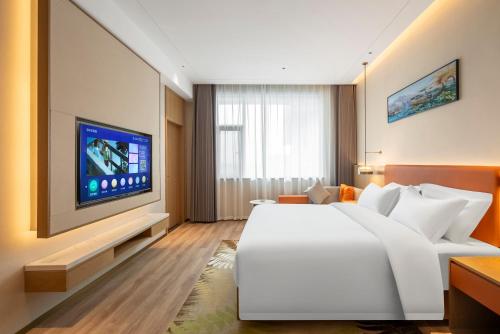Imagen de la habitación del Hotel Hawthorn by Wyndham Xishuang Banna Jinghong. Foto 6