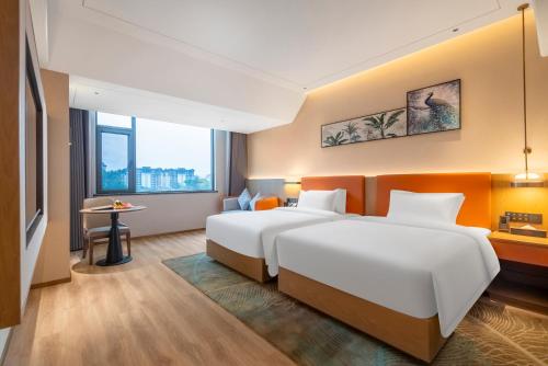 Imagen de la habitación del Hotel Hawthorn by Wyndham Xishuang Banna Jinghong. Foto 7