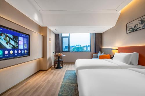 Imagen de la habitación del Hotel Hawthorn by Wyndham Xishuang Banna Jinghong. Foto 8
