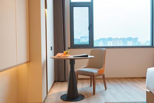 Imagen de la habitación del Hotel Hawthorn by Wyndham Xishuang Banna Jinghong. Foto 9