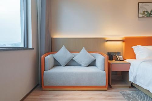 Imagen de la habitación del Hotel Hawthorn by Wyndham Xishuang Banna Jinghong. Foto 10