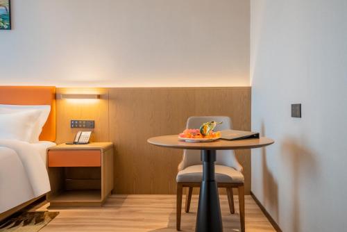 Imagen de la habitación del Hotel Hawthorn by Wyndham Xishuang Banna Jinghong. Foto 11