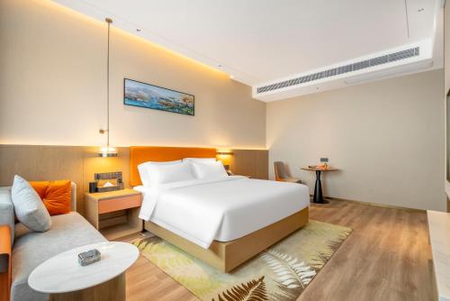 Imagen de la habitación del Hotel Hawthorn by Wyndham Xishuang Banna Jinghong. Foto 12