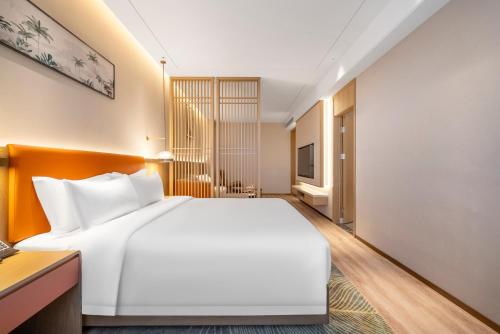 Imagen de la habitación del Hotel Hawthorn by Wyndham Xishuang Banna Jinghong. Foto 14