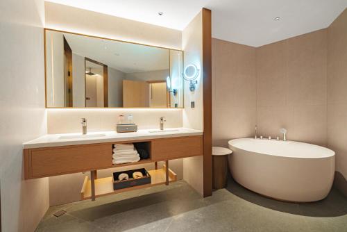 Imagen de la habitación del Hotel Hawthorn by Wyndham Xishuang Banna Jinghong. Foto 16