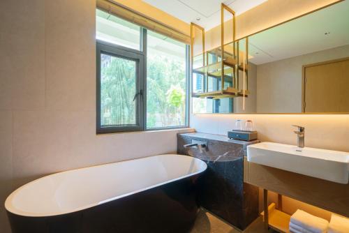 Imagen de la habitación del Hotel Hawthorn by Wyndham Xishuang Banna Jinghong. Foto 20