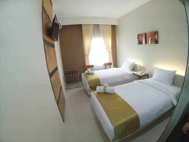 Imagen de la habitación del Hotel Hazotel Semarang. Foto 26