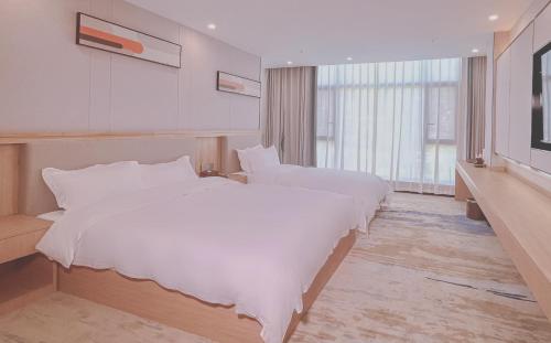 Imagen de la habitación del Hotel He of Banma Resorts. Foto 18