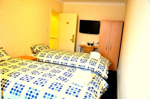 Imagen de la habitación del Hotel Heathrow Lodge. Foto 9