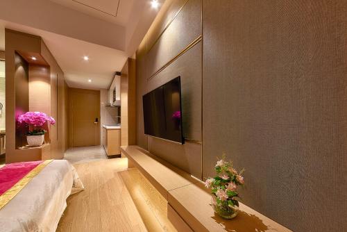 Imagen de la habitación del Hotel Heefun Apartment - Fuli New World Plaza. Foto 6