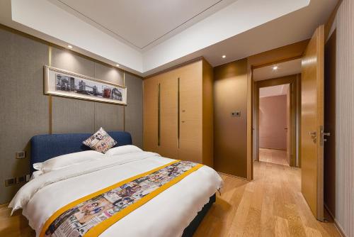 Imagen de la habitación del Hotel Heefun Apartment - Fuli New World Plaza. Foto 8