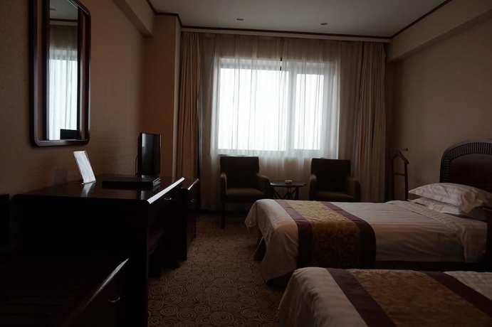 Imagen de la habitación del Hotel Heilongjiang Kunlun. Foto 10