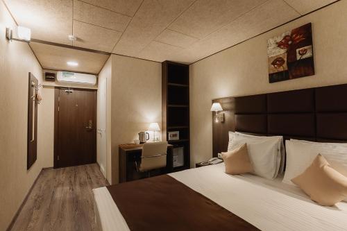 Imagen de la habitación del Hotel Helix, Sochi. Foto 8