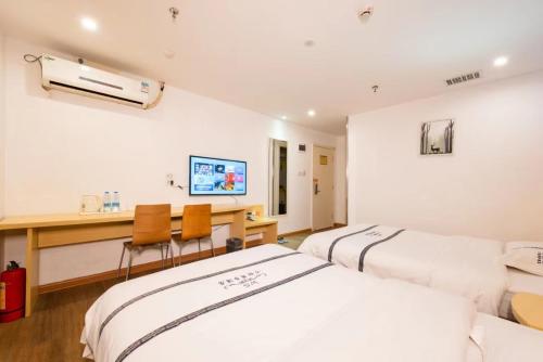 Imagen de la habitación del Hotel Hello 哈啰酒店广州新市百信广场店. Foto 18
