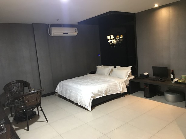 Imagen de la habitación del Hotel Hengbo. Foto 17