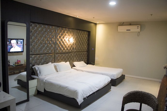 Imagen de la habitación del Hotel Hengbo. Foto 19