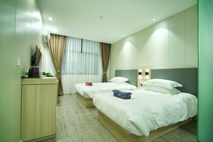 Imagen de la habitación del Hotel Hengdian Chayan Guest House. Foto 14