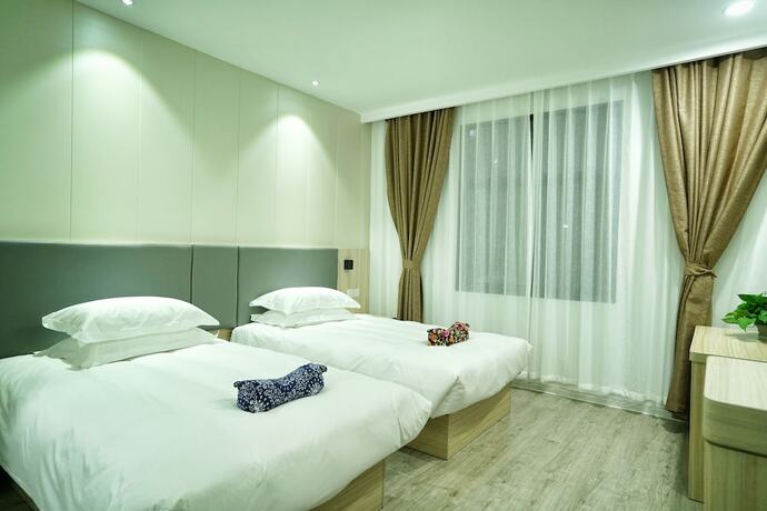 Imagen de la habitación del Hotel Hengdian Chayan Guest House. Foto 16