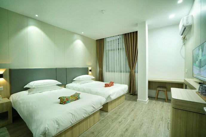 Imagen de la habitación del Hotel Hengdian Chayan Guest House. Foto 18