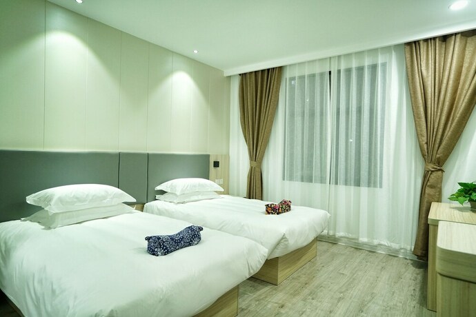 Imagen de la habitación del Hotel Hengdian Chayan Guest House. Foto 19