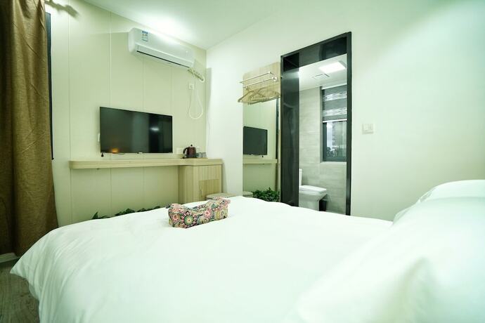 Imagen de la habitación del Hotel Hengdian Chayan Guest House. Foto 24